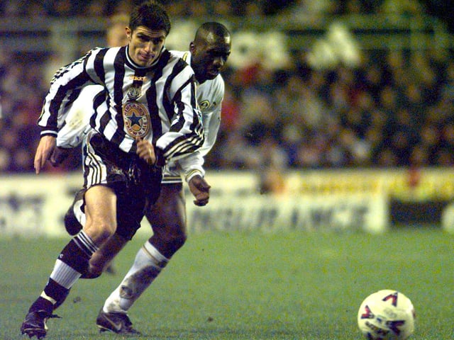 Jimmy Floyd Hasslebaink chases after Aaron Hughes.