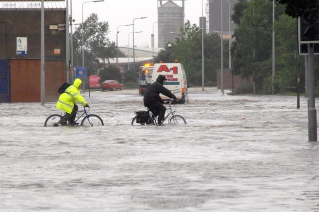 The city of Hull was pummelled by rain for hours on June 25, 2007. Nearly every one of the city's 98 schools were damaged by the heavy rainfall, with thousands of people forced from their homes.
This picture was taken from June 25, 2007, with people cycling through water on Cleveland Street in Hull.