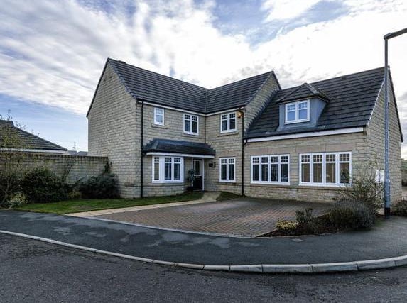This five bedroom detached home up at Blackley near Elland is set to a generous corner plot. There is a fenced, enclosed lawned garden with feature patio and decked area, home to a hot tub. Martin Thornton Estate Agents - 01484 973724