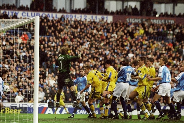 Alan Smith claims Leeds' second equaliser after chaos in the Manchester City goalmouth.
