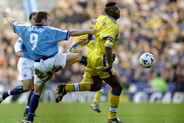 Lucas Radebe shields the ball from Manchester City striker Paul Dickov.