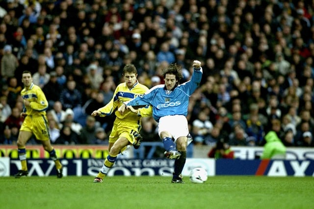 Manchester City's Ian Bishop passes under pressure from Stephen McPhail.