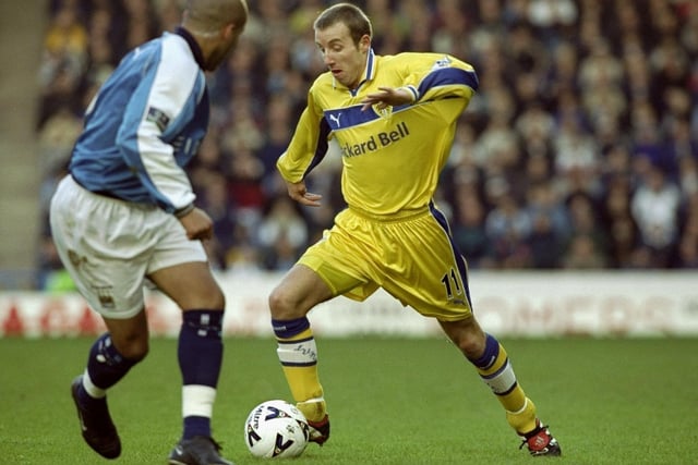 Lee Bowyer takes on Manchester City's Richard Edgehill.