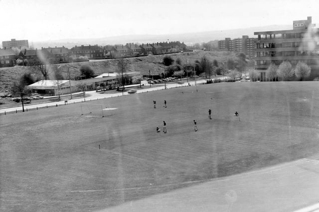 The school playing field in 1973. The view looks towards the A6120 Ring Road (Horsforth to West Park section) and West Park Motors Ltd. Across the sloping field are the Latchmere Estate on the left.