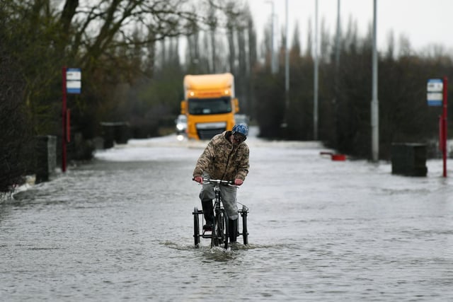 Drivers and cyclists struggled to get through the floodwater.