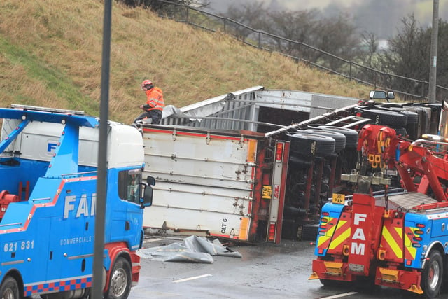 The overturned lorry (photo: PA Wire/ Danny Lawson)