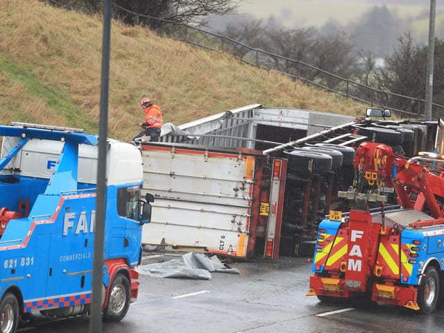 The overturned lorry (photo: PA Wire/ Danny Lawson)