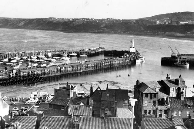 Panormaic view over the tiled rooftops of Scarborough harbour front in 1963.