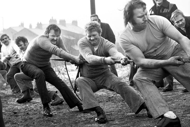 January 1974 - A tug of war contest over the Leeds/Liverpool canal on a cold and frosty day in New Springs.