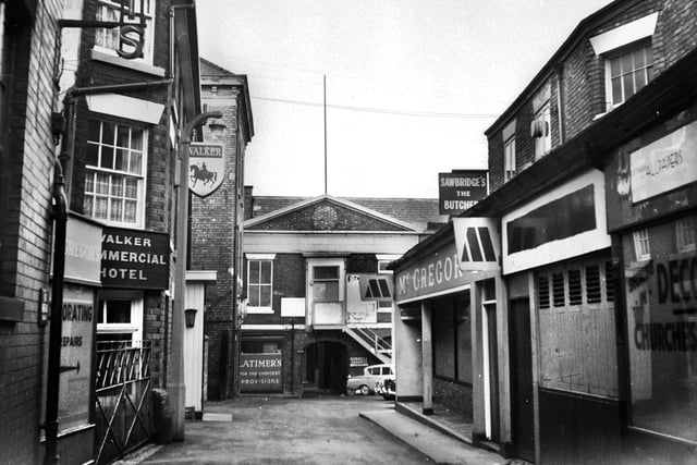 The Commercial Yard in January 1971. The Commercial Hotel on the left and memories of a pie and pint of Double Diamond. Latimer's grocers in the middle, Sawbridge's butchers and McGregors painting and decorating shops on the right.