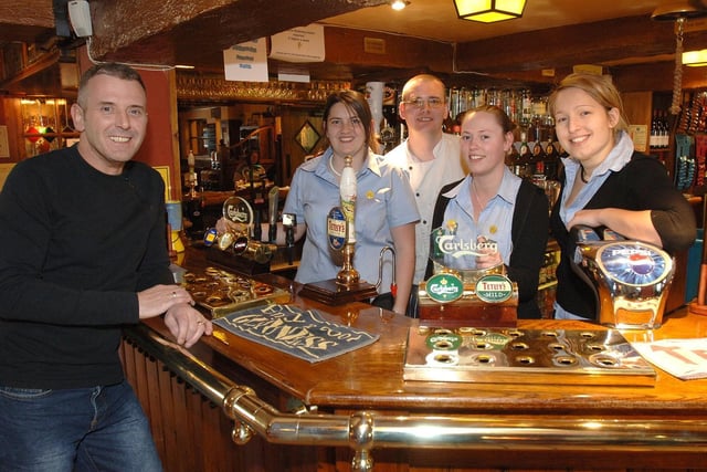 Landlord Paul Madden with bar staff Donna Pilling, chef Paul Counsell, Lisa Critchley and Maria Zvonaric at The Hare and Hounds pub, Lowton, 2006.