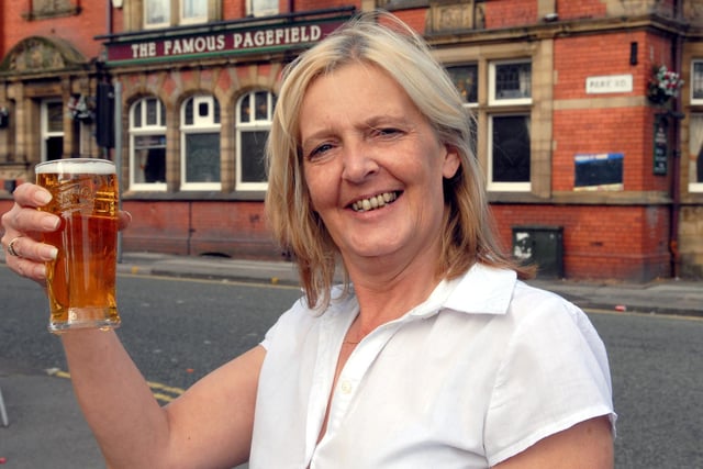 The Famous Pagefield, Wigan, landlady Sharon Arkell celebrates the re-opening of the pub in 2008.