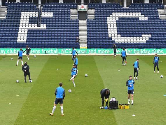 The Preston players warm up before the game.