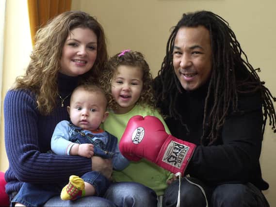 Retiring boxing Leeds champion Ashley Crawford with his wife Hayley and children Asia, three and 15-month-old Theo. PIC: Mel Hulme
