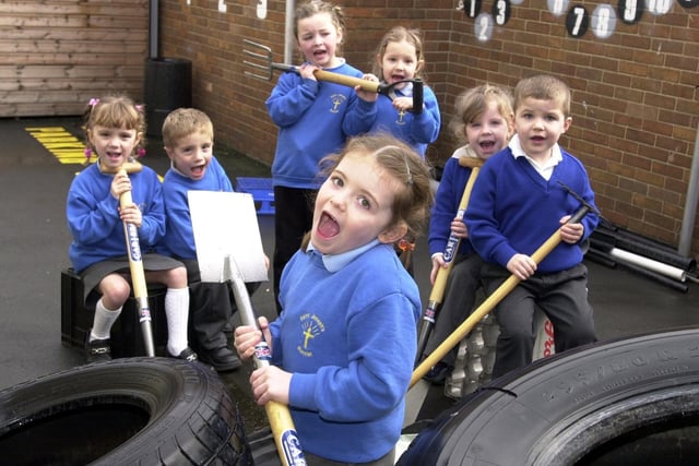 St Joseph's Catholic Primary reception pupil Suzanne Lowe with classmates Clarice Parrish, Jake Parrish, Hannah McShane, Emily Killeen, Carooline Duffy and Thomas with tools at the ready to transform a derelict yard at the school into an educational play area.