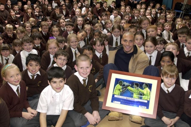 Rio Ferdinand presents the Leeds United Kick Racism Out of Football award to Beeston St. Anthony's Primary.