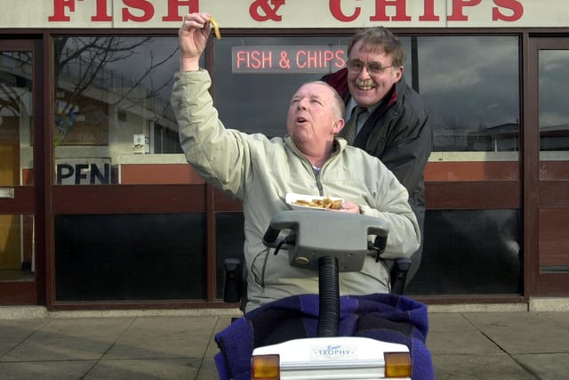 Coun Geoff Driver joins disabled resident John Tallant in celebration of new ramps being installed on Pym Street at Hunslet. They allowed John to get to his favourite fish and chip shop.