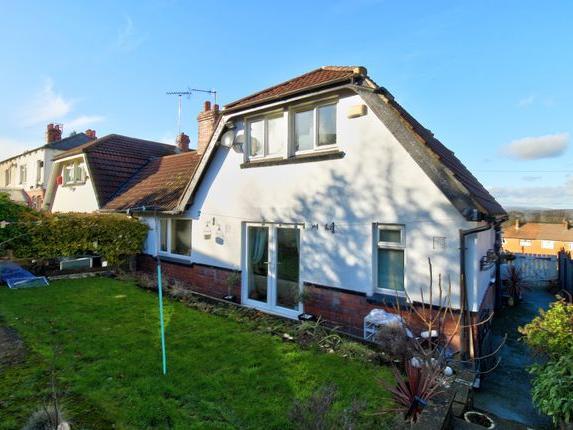 Extremely well presented three bedroom semi-detached Dutch bungalow in a sought after location. The property benefits from a modern kitchen and bathroom, two spacious reception rooms, three bedrooms, off road parking and stunning panoramic far reaching views.
The accommodation briefly comprises; entrance hall, spacious lounge and dining room, modern fitted kitchen with electric oven and hob with extractor hood above and space for appliances, beautiful bathroom with Morrocan tiles and three piece white suite and a ground floor bedroom/home office. On the first floor there are two further double bedrooms.