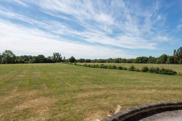 The property is surrounded by beautiful rural grounds, providing plenty of space for outdoor exploring in a quiet and picturesque spot.