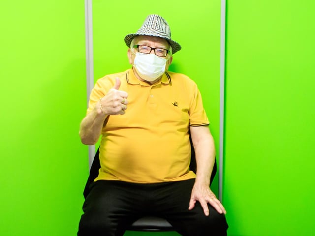 Michael Edkins gives a thumbs up after being vaccinated at the centre which is the first of the region’s four centres to open and will mean thousands more appointments can be offered to both patients and health and social care staff (photo: PA Wire/ Danny Lawson)