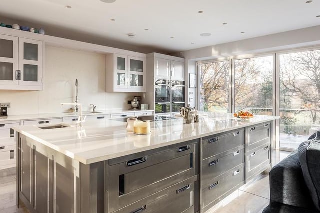 The kitchen has high quality cabinetry with feature mirrored inserts, glazed display units, bar area with glass storage, integrated appliances including double 'Miele' ovens and warming drawers, double wine chiller.