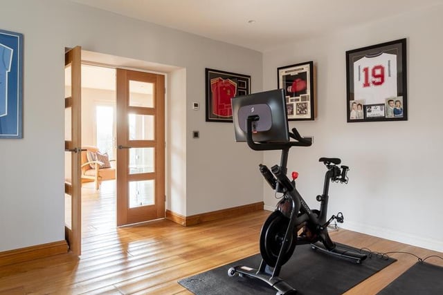 The home has space for a home office or gym. It is accessed from the hall via double oak and multi-paned doors and the spacious room offers versatility in use to suit personal requirements. There is also a utility room.
