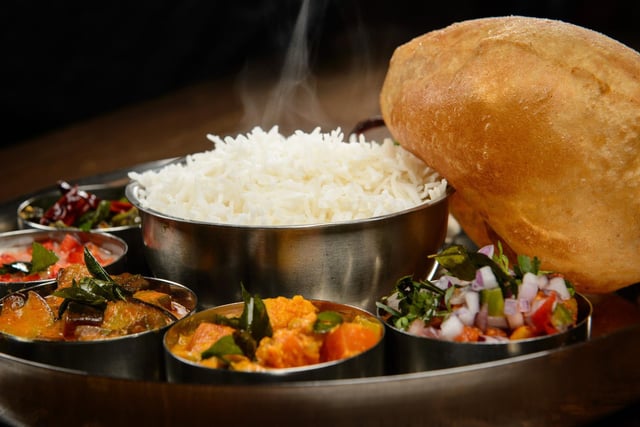 A Michelin Guide judge described Tharavadu, in Mill Hill, as: "A simple-looking restaurant with seascape murals. The extensive menu offers superbly spiced, colourful Keralan specialities and refined street food – the dosas are a hit. Service is friendly and dishes arrive swiftly."