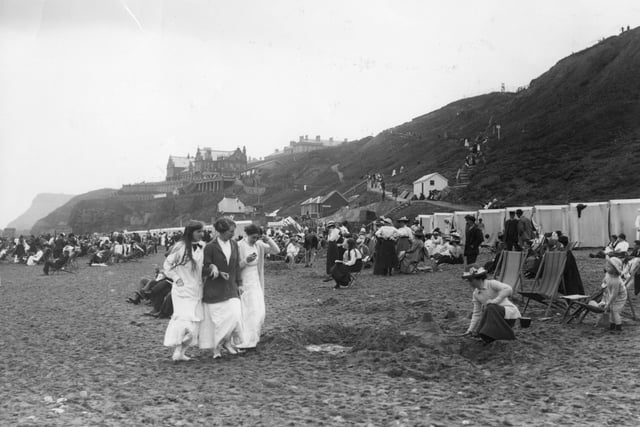 1913: A scene on the beach at Whitby in North Yorkshire.