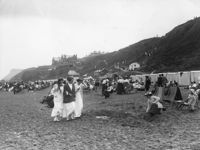 1913: A scene on the beach at Whitby in North Yorkshire.