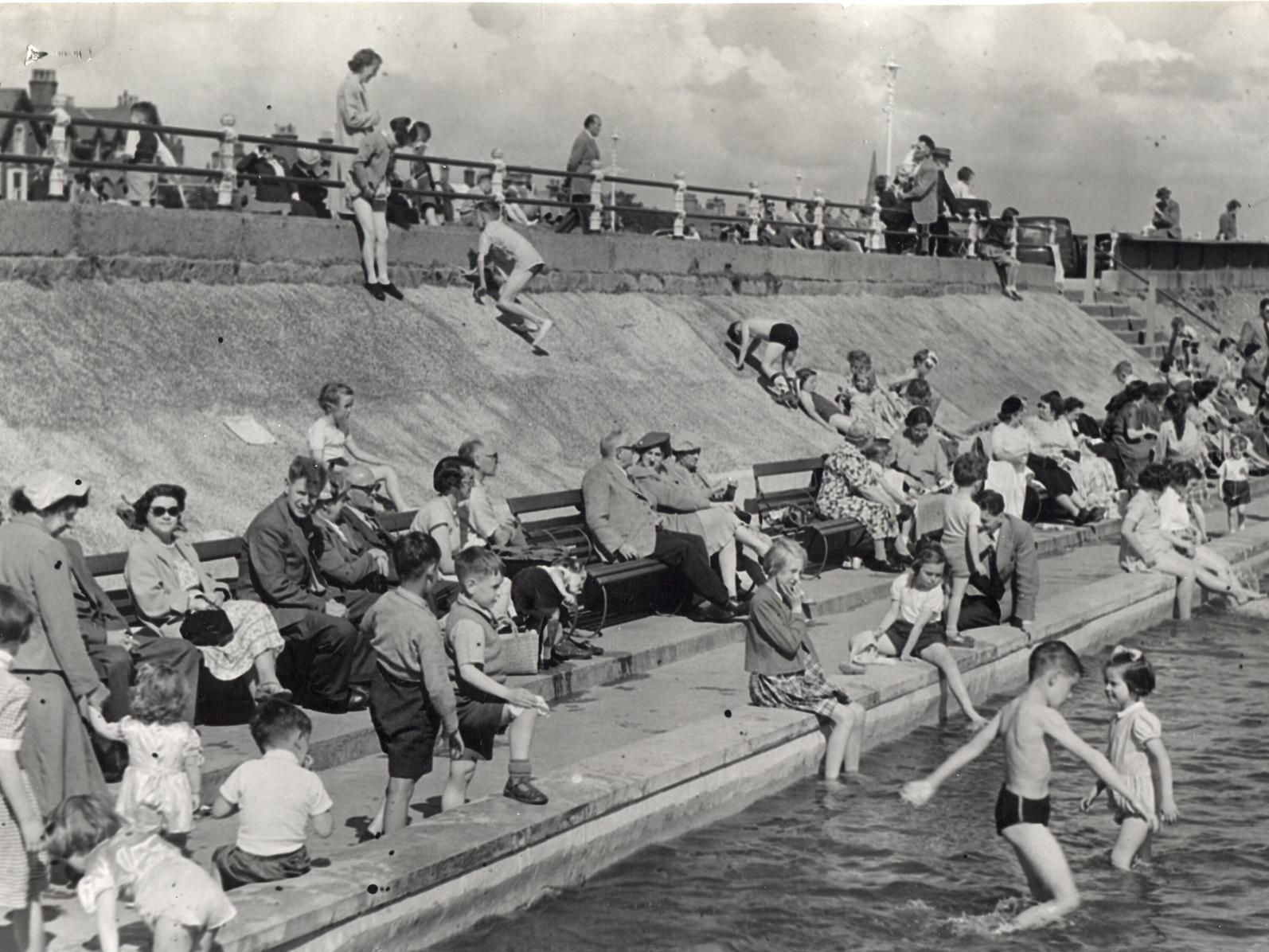 Holiday makers swarm round Lytham's paddling pool in the heat of 1954 proving that the resort has a long tradition of seasonal visitors