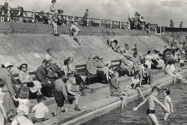 Holiday makers swarm round Lytham's paddling pool in the heat of 1954 proving that the resort has a long tradition of seasonal visitors