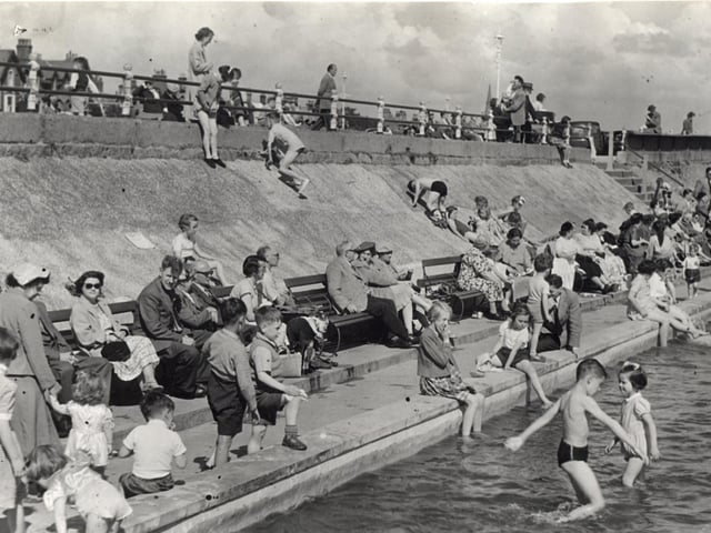 Holiday makers swarm round Lytham's paddling pool in the heat of 1954 proving that the resort has a long tradition of seasonal visitors