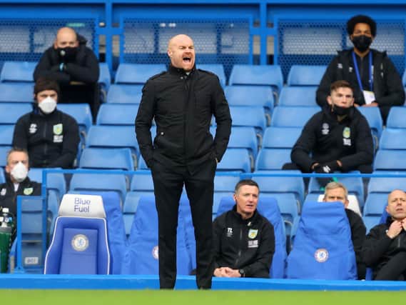 Burnley's English manager Sean Dyche shouts instructions to his players from the touchline during the English Premier League football match between Chelsea and Burnley at Stamford Bridge in London on January 31, 2021.