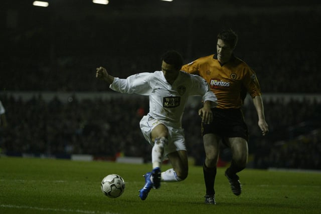 Jermaine Pennant battles for ball with Mark Kennedy.