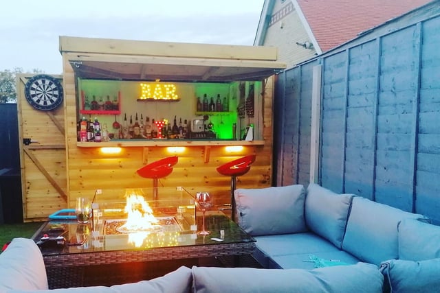 Stacey Nicole is all toasty in her bar - complete with fire pit