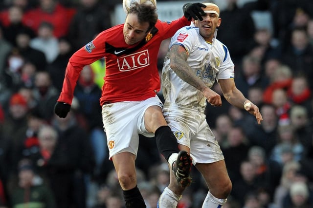 Heads up for Patrick Kisnorbo and Manchester United's Dimitar Berbatov during the FA Cup third round clash at Old Trafford in January 2010.