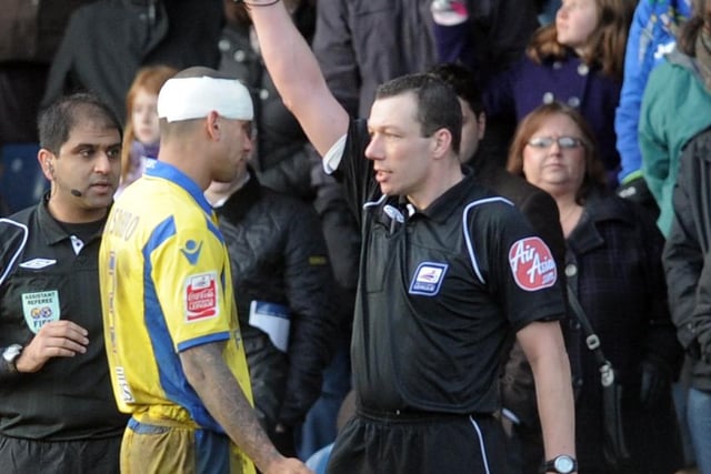 Patrick Kisnorbo is booked during the Coca Cola League One clash against Stockport County in December 2009.