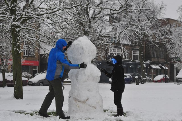 Building a snowman on West Park Stray...