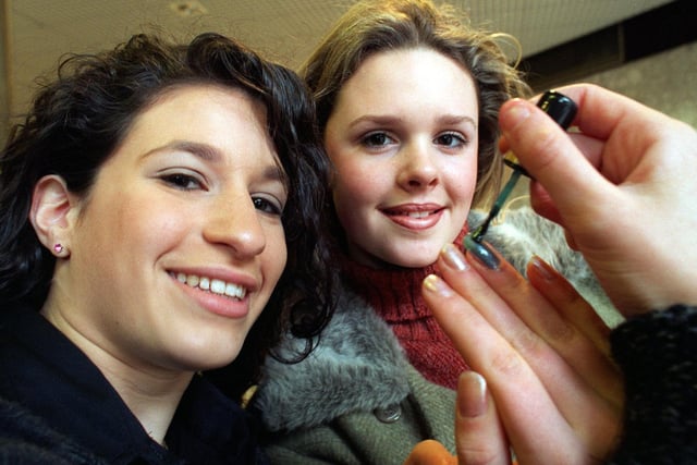 Two girls from Gateways School - Kelly Serr (left) and Lucinda Higgins -  demonstrate some of the nail varnish sold by their company Renaissance at the Merrion Centre as part of the Schools Young Enterprise initiative.