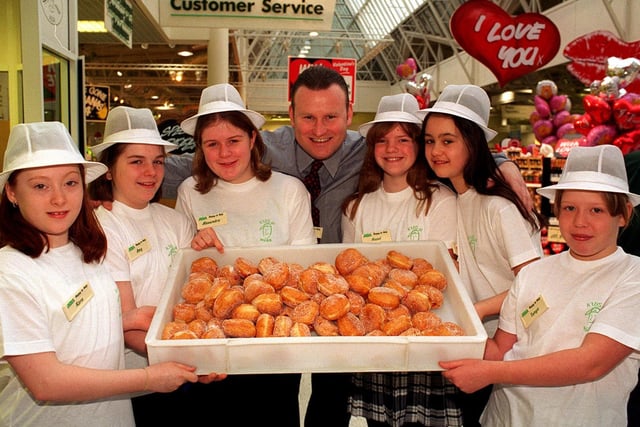 ASDA store manager Richard Woodhall with some of the school children who were  attending 'Kids At Work' at  the Owlcotes Centre store. Pictured, from left, are Kara Priestley, Amy Rosier, Alexandra King, Hazel White, Maria Tunnicliff and Tanya Douglas.