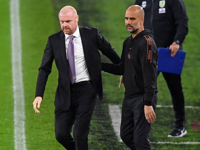 Burnley's English manager Sean Dyche and Manchester City's Spanish manager Pep Guardiola after the English League Cup fourth round football match at Turf Moor in Burnley, north west England on September 30, 2020.