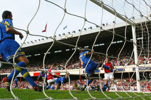 Dennis Bergkamp scores Arsenal's second goal .