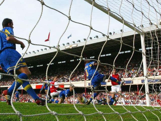 Dennis Bergkamp scores Arsenal's second goal .