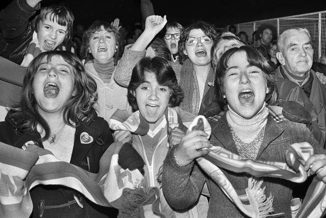 Wigan Athletic fans celebrate their team's victory over Division 3 Blackpool in the FA Cup 1st round replay at Springfield Park on Wednesday 28th of November 1979. Fourth division Latics won the match 2-0 with goals from Frank Corrigan and Tommy Gore.