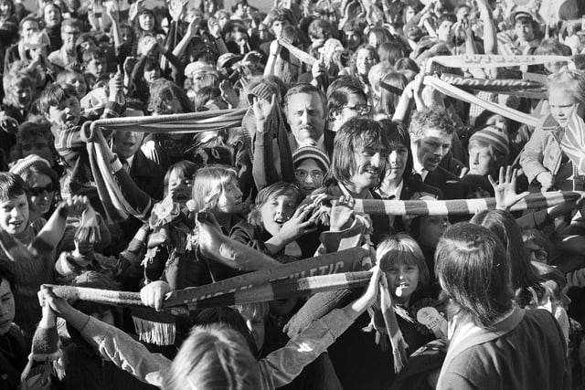Wigan Athletic players Johnny King and Albert Jackson and manager, Les Rigby, swamped by fans at Springfield Park on Sunday 29th of April to welcome home the team despite losing in the FA Trophy final.