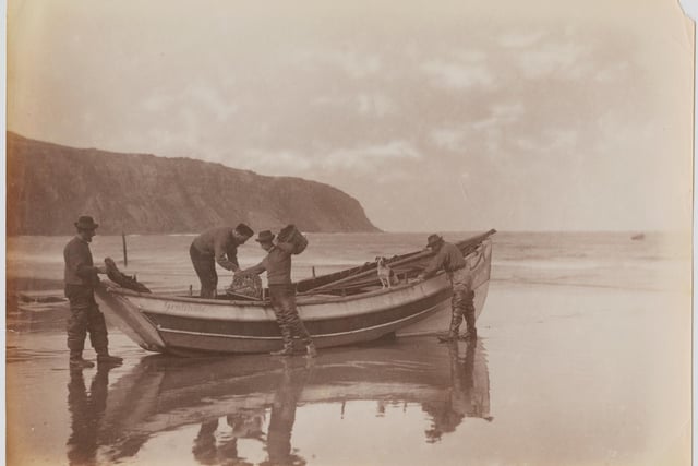The Storm family of Robin Hood's Bay, Whitby, North Yorkshire, circa 1895. They are Thomas, Reuben, Mathew, Spy the dog and Issac, a farmer who is also cox of the lifeboat.