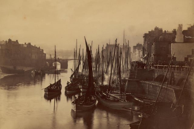 Fishing boats moored in Whitby harbour, circa 1880.