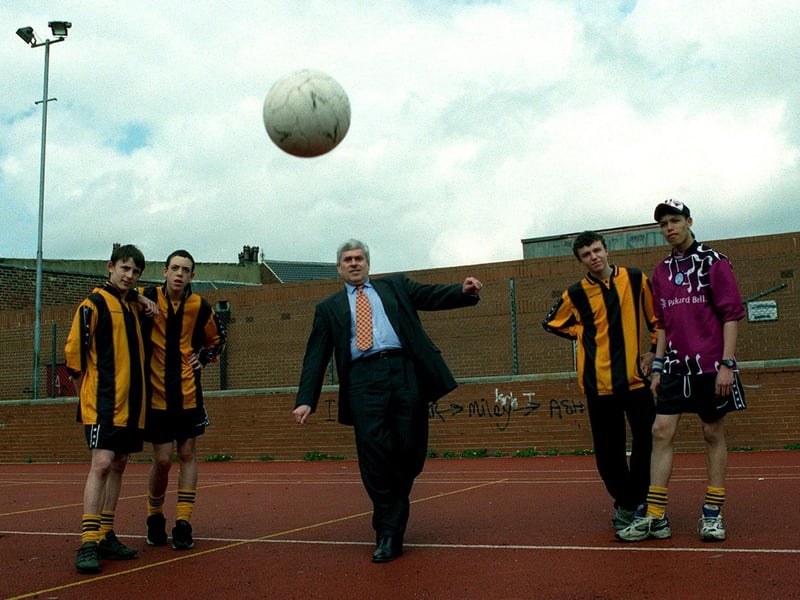 Leeds United chairman Peter Ridsdale tests his footballing skills after presenting a cheque for £7,000 to Holbeck Youth Club. Also pictured are Holbeck Hornets football team based at the Club. They are Gareth Robinson, Robert Kitchingman, Matthew Allotey and  and Benjy Baker.