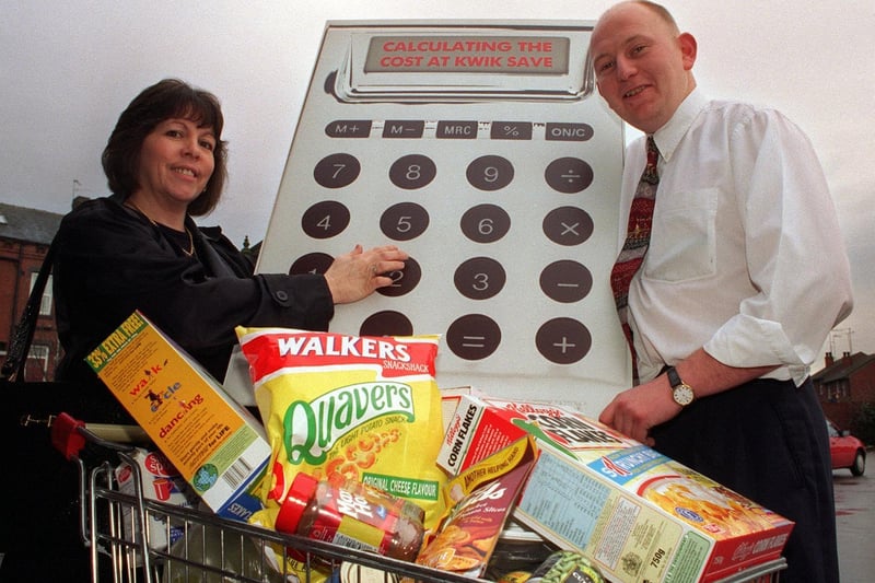Susan Watson receives her prize at Kwik Save supermarket in Holbeck, from store Manager Jason Redshaw after she participated in the Calls Cut Costs Helpline scheme.