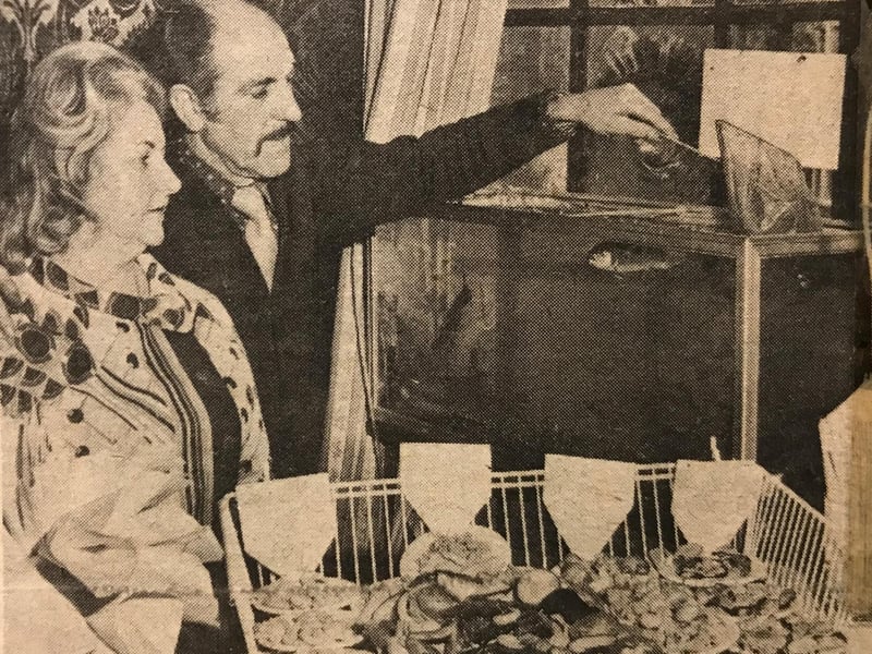 The Golden Guinea, which became Bacchus in 1981, was once noted for its food. This photo from 1975 shows owners Stan and Mandy Roberts with a newly installed trout tank, from which customers could choose their fish.